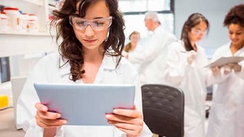 Lab tech looking at tablet