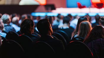 conference attendees looking at stage 